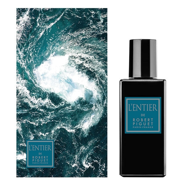 Piguet - L'Entier Parfumflakon mit schwarzem Design vor dynamischer Meeresbrandung und türkisfarbener Etikettgestaltung