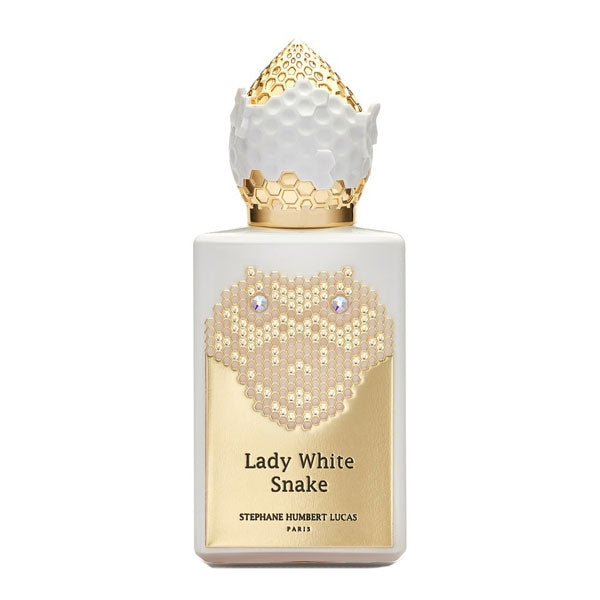 Stéphane Humbert Lucas 777 - Lady White Snake Flakon mit weißem Gehäuse und goldener Reliefschlange vor hellen Hintergrund