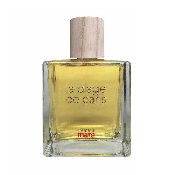 Mare - La Plage de Paris Parfümflakon mit klarem Glas und hellem Holzverschluss vor weißem Hintergrund