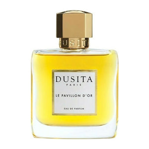 Dusita - Le Pavillon d'Or Parfumflakon mit goldenem Verschluss und gelbem Duftöl vor weißem Hintergrund