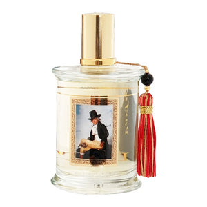 Parfums MDCI Paris - Masterpiece Collection - L'Elégant Flakon mit goldfarbenem Sprühkopf und dekorativem roten Quast vor weißem Hintergrund