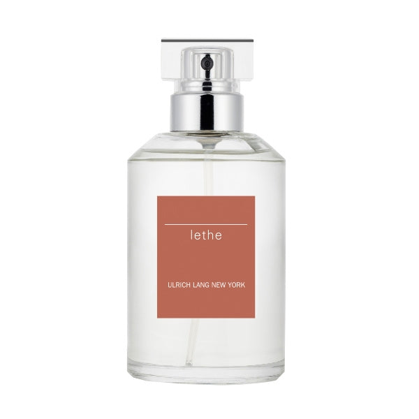 Ulrich Lang - Lethe Parfumflakon mit transparentem Glas und rechteckigem orangefarbenem Etikett vor weißem Hintergrund