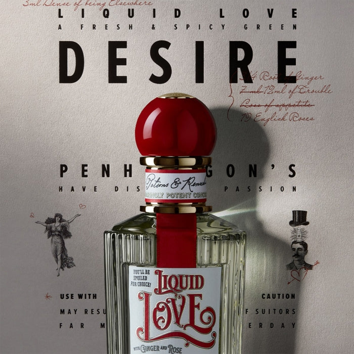 Penhaligon's - Potions & Remedies - Liquid Love Flakon mit markantem roten Verschluss vor beigefarbenem Hintergrund