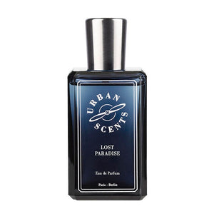 Urban Scents - Lost Paradise Parfumflakon in dunkelblauem Glas mit silbernem Verschluss auf weißem Hintergrund