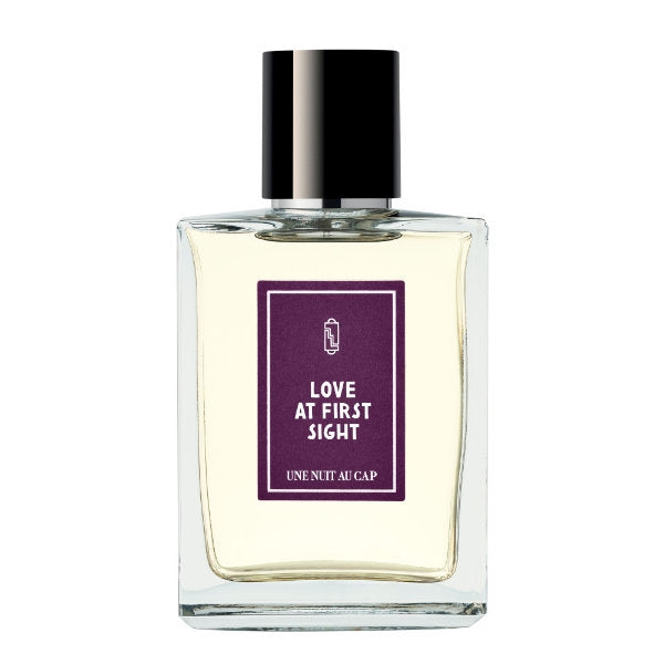 Une Nuit Nomade - Une Nuit au Cap - Love At First Sight zeigt klaren Flakon mit dunklem Verschluss und violettem Etikett