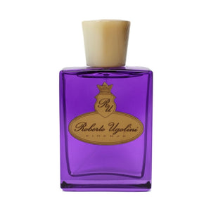 Roberto Ugolini - Marzocco Parfumflakon in violettem Glas mit beigeartigem Verschluss und goldfarbenem Logo auf weißem Hintergrund