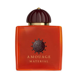 Amouage - Material Parfumflakon in leuchtendem Orange mit brauner Kuppelkappe und goldfarbenem Detail vor weißem Hintergrund