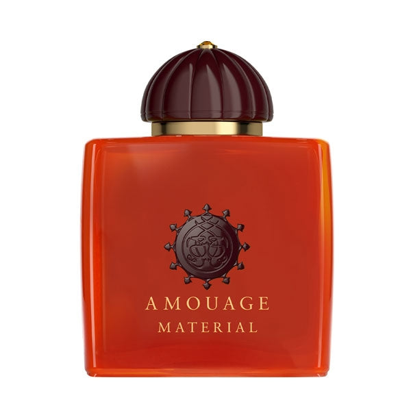 Amouage - Material Parfumflakon in leuchtendem Orange mit brauner Kuppelkappe und goldfarbenem Detail vor weißem Hintergrund