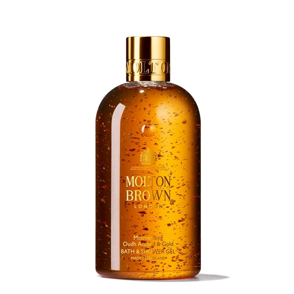 Molton Brown - Mesmerising Oudh Accord & Gold Bath & Shower Gel mit 24 Karat Goldflocken im transparenten Flakon
