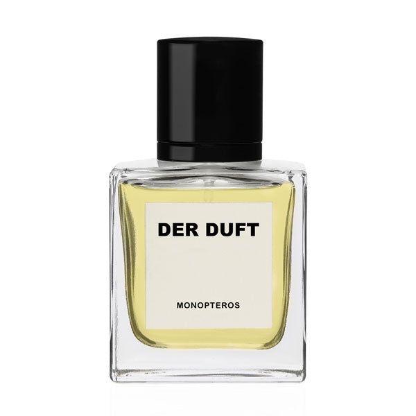 DER DUFT - Monopteros Parfumflakon mit quadratischem Glas, hellem Inhalt und schwarzem Verschluss vor weißem Hintergrund