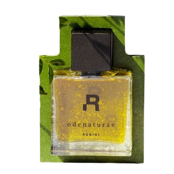 Rubini - Odenaturae zeigt klaren Flakon mit schwarzem Verschluss und grüner Verpackung, inspiriert von Natur und Waldlandschaft