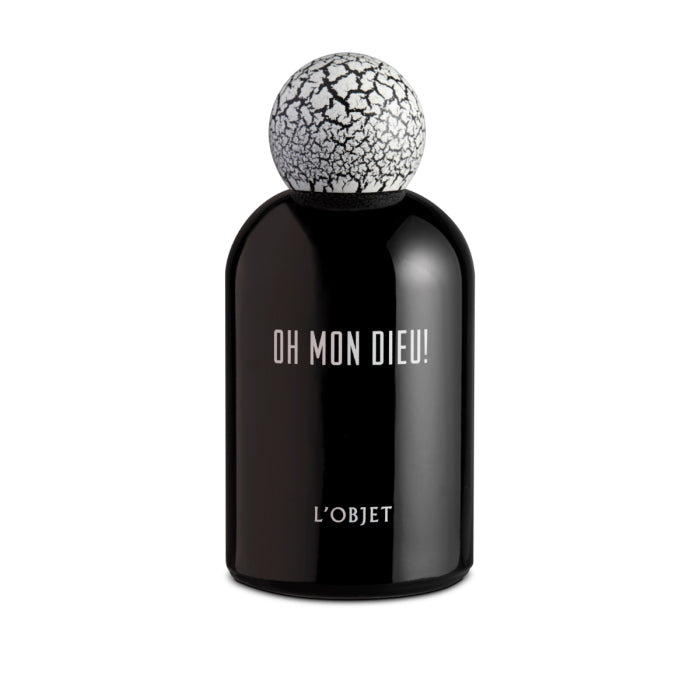 L'Objet - Oh Mon Dieu! Parfum in tiefschwarzem Glas mit charakteristischem weiß-rissigem Kugelverschluss präsentiert