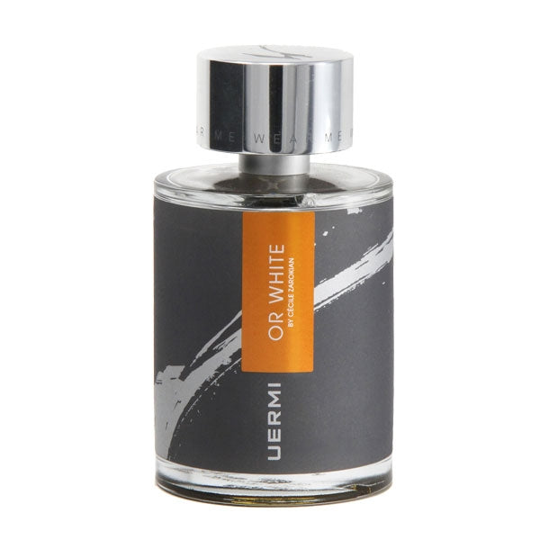 UERMI - OR WHITE Parfumflakon mit silbernem Deckel und modernem schwarz-orangem Etikett vor weißem Hintergrund