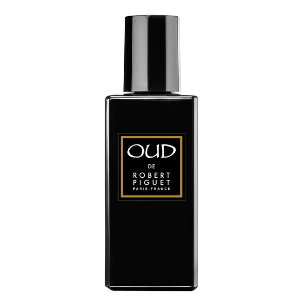 Piguet - Oud zeigt schwarzen, rechteckigen Parfumflakon mit goldumrahmtem Etikett und glänzendem Verschluss elegant gestaltet