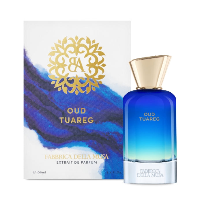 Fabbrica della Musa - Oud Touareg Parfümflakon in blauem Farbverlauf mit goldenem Verschluss vor künstlerischer Verpackung