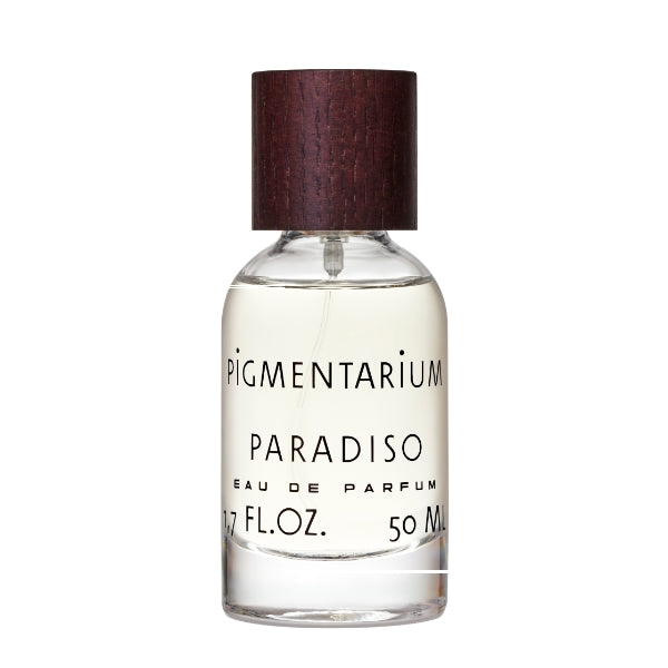 Pigmentarium - Paradiso zeigt transparenten Flakon mit hellem Duftöl und dunklem Holzverschluss auf weißem Hintergrund