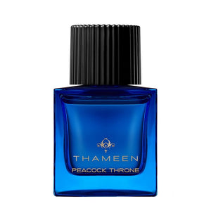 Thameen - Treasure Collection - Peacock Throne Parfumflakon in tiefblauem Glas mit schwarzem geriffeltem Deckel vor weißem Hintergrund