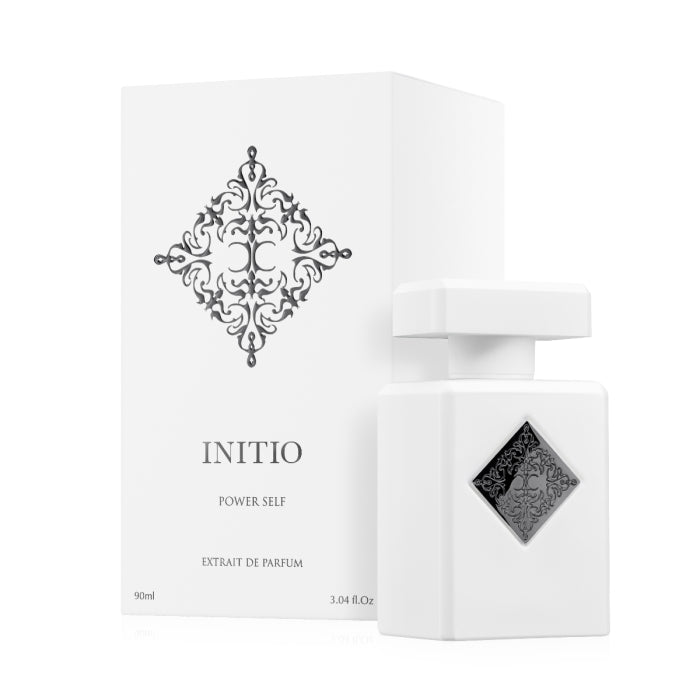 Initio - Hedonist Collection - Power Self Parfumflakon in weiß mit schwarzem Ornament und passender Verpackung vor weißem Hintergrund