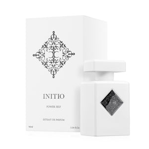 Initio - Hedonist Collection - Power Self Parfumflakon in weiß mit schwarzem Ornament und passender Verpackung vor weißem Hintergrund