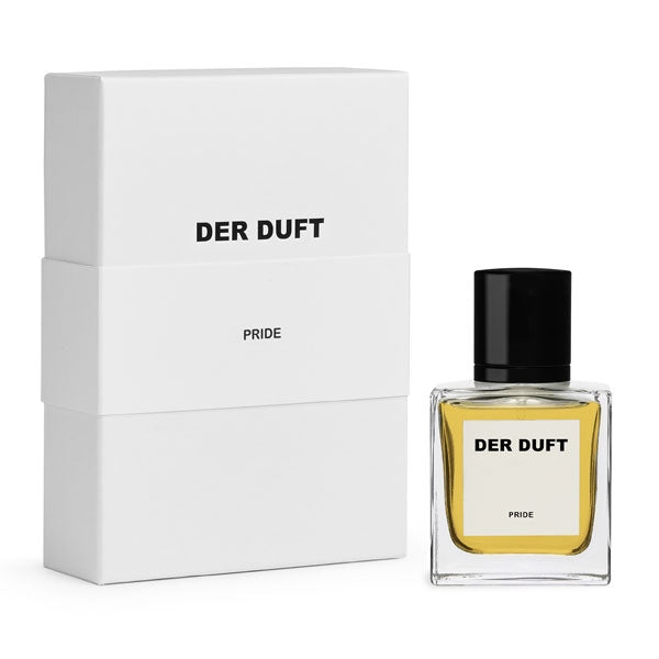 DER DUFT - Pride Parfumflakon mit klarem Glas, hellem Inhalt und schwarzem Verschluss neben weißer Verpackung