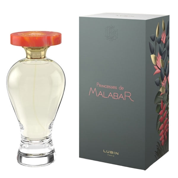 Lubin - Princesses de Malabar Parfumflakon mit transparentem Glas und oranger Kappe neben eleganter Verpackung