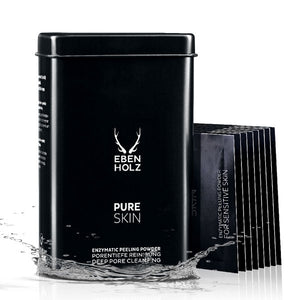 EBENHOLZ - Pure Skin Enzympeeling Pulver in schwarzer Dose mit Wasser umspült und Produktproben daneben