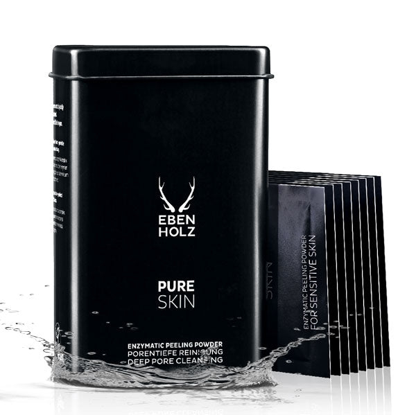 EBENHOLZ - Pure Skin Enzympeeling Pulver in schwarzer Dose mit Wasser umspült und Produktproben daneben