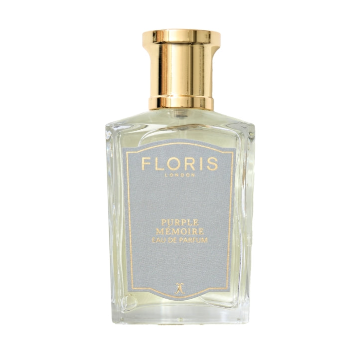 Floris - Purple Mémoire eleganter klarer Parfumflakon mit goldenem Verschluss und zart bläulichem Etikett auf weißem Hintergrund