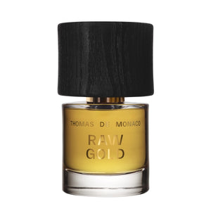 Thomas de Monaco - Raw Gold Parfumflakon mit goldenem Duft und massivem schwarzen Holzverschluss vor weißem Hintergrund