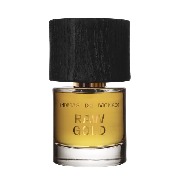 Thomas de Monaco - Raw Gold Parfumflakon mit goldenem Duft und massivem schwarzen Holzverschluss vor weißem Hintergrund
