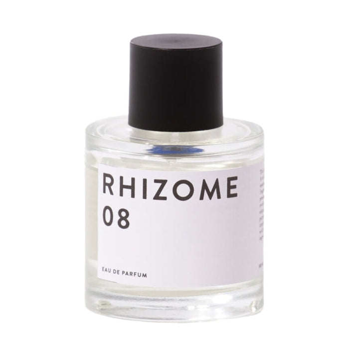 Rhizome - 08 Parfumflakon mit schlichtem weißen Etikett und schwarzem Deckel vor weißem Hintergrund