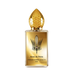 Stéphane Humbert Lucas 777 - Rose de Petra zeigt goldglänzenden Flakon mit wabenförmigem Deckel und filigranem Design