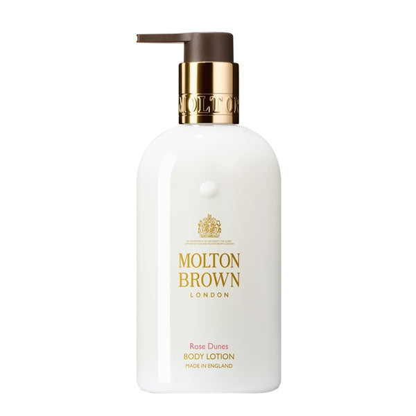 Molton Brown - Rose Dunes - Body Lotion mit goldfarbenem Spender auf weißem Hintergrund, edles Design
