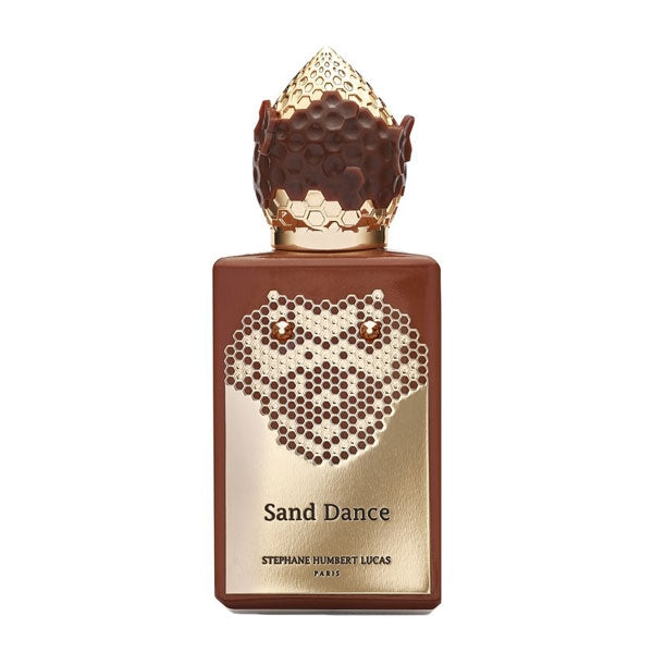 Stéphane Humbert Lucas 777 - Sand Dance Parfumflakon mit braunem Gehäuse und goldener Wabenverzierung vor weißem Hintergrund