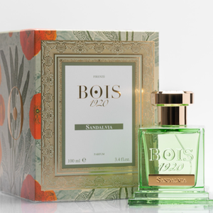 Bois 1920 - Sandalvia Parfumflakon in klarem Grün mit goldenem Verschluss vor floral dekoriertem Karton