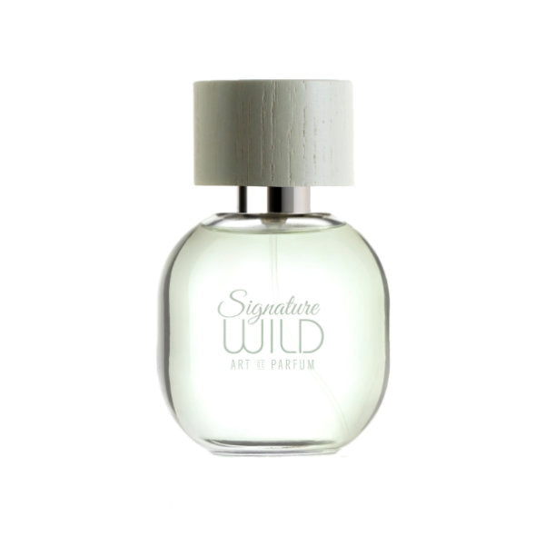 Art de Parfum - Signature Wild klarer Flakon mit rundem hellen Verschluss vor hellem Hintergrund