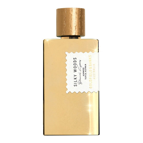 Goldfield & Banks - Botanical Series - Silky Woods Parfumflakon in elegantem goldfarbenem Design mit rundem Verschluss vor weißem Hintergrund