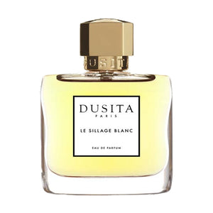 Dusita - Le Sillage Blanc Parfumflakon mit klarem Glas, goldfarbenem Verschluss und hellem Duft vor weißem Hintergrund