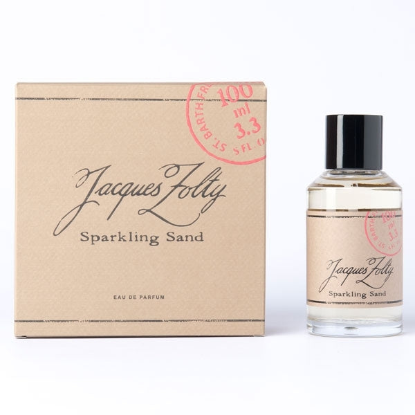Jacques Zolty - Original Collection - Sparkling Sand Parfumflakon und beige Geschenkbox mit rotem Stempel vor weißem Hintergrund