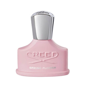 Creed - Spring Flower rosafarbener Flakon mit silbernem Deckel und eingeprägtem Logo auf weißem Hintergrund