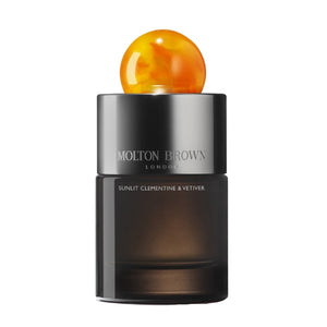 Molton Brown - Sunlit Clementine & Vetiver Eau de Parfum mit elegantem dunklem Flakon und orangefarbener Kugel als Verschluss