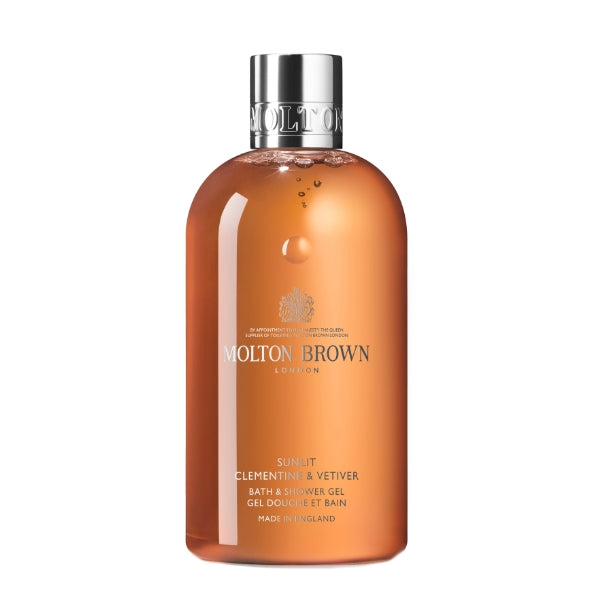 Molton Brown - Sunlit Clementine & Vetiver Bath & Shower Gel in transparenter Flasche mit silbernem Verschluss