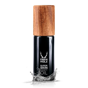 EBENHOLZ - Super Skin Kraft Oil schwarzer Flakon mit Holzdeckel und Wasserfontäne vor weißem Hintergrund