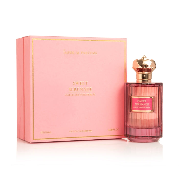 Imperial Parfums - Sweet Serenade edler rosa Flakon mit goldfarbenem kronenförmigem Verschluss neben eleganter Verpackung