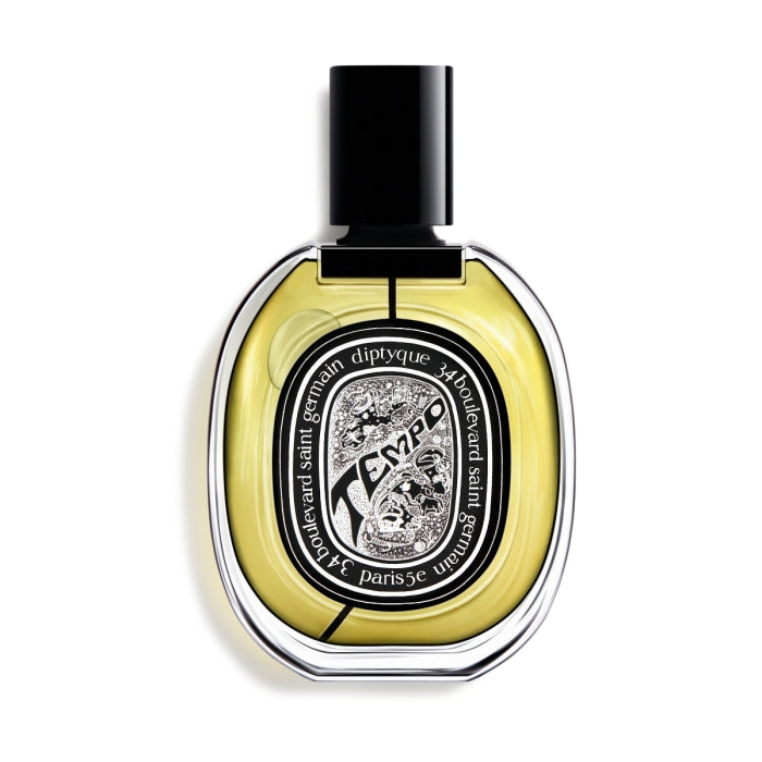Diptyque - Tempo eleganter Parfumflakon mit schwarzem Verschluss und verspielt floralem Etikett vor weißem Hintergrund