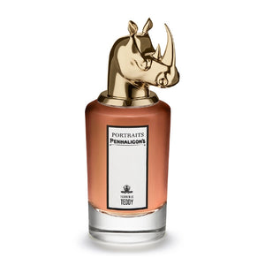 Penhaligon's - Portraits - Terrible Teddy Parfumflakon mit bronzefarbenem Nashornkopf und bernsteinfarbener Flüssigkeit vor weißem Hintergrund