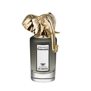 Penhaligon's - Portraits - The Omniscient Mr. Thompson zeigt Flakon mit goldenem Elefantenkopf und schwarzem Glasfuß