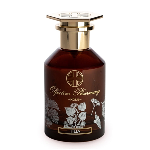 Olfactive Pharmacy - Tilia Parfumflakon aus braunem Glas mit goldenem Verschluss und Lindenblüten-Dekor