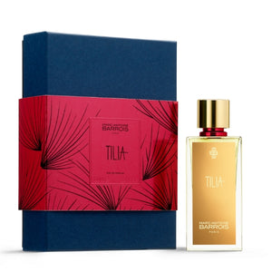 Marc-Antoine Barrois - Tilia Parfümflakon mit goldfarbenem Etikett und Geschenkbox in Blau und Rot vor weißem Hintergrund