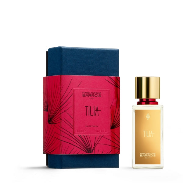 Marc-Antoine Barrois - Tilia Parfümflakon mit goldfarbenem Etikett neben roter Geschenkbanderole und blauer Verpackung